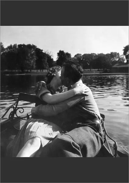 Couple kissing on boating lake