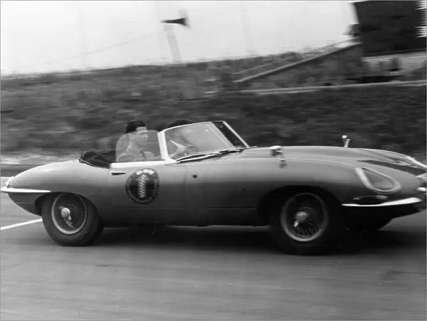Prince Michael of Kent driving an E-type Jaguar at Brands Ha