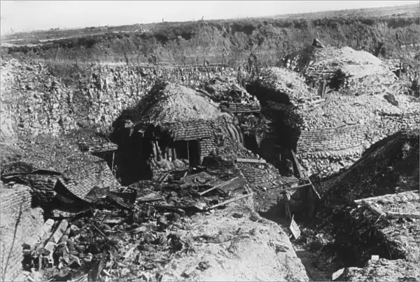 Dugouts cut into a hillside, WW1