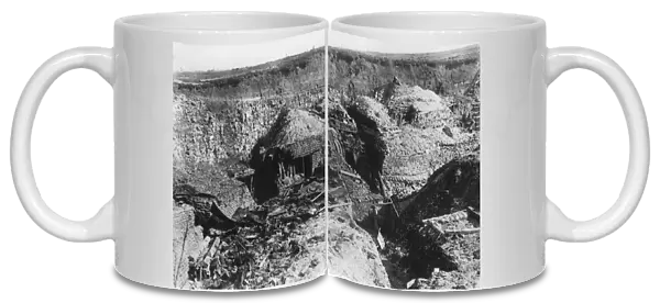 Dugouts cut into a hillside, WW1