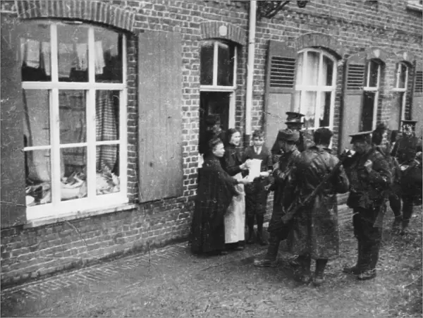 Inhabitants giving coffee to British troops, Flanders, WW1