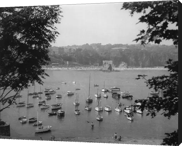 TENBY BAY. A quiet scene, with moored craft in the harbour at Tenby, Pembrokeshire, Wales