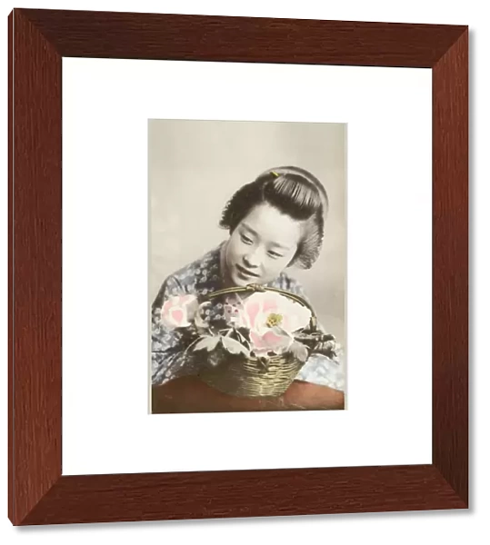Japan - Geisha girl with a basket of flowers