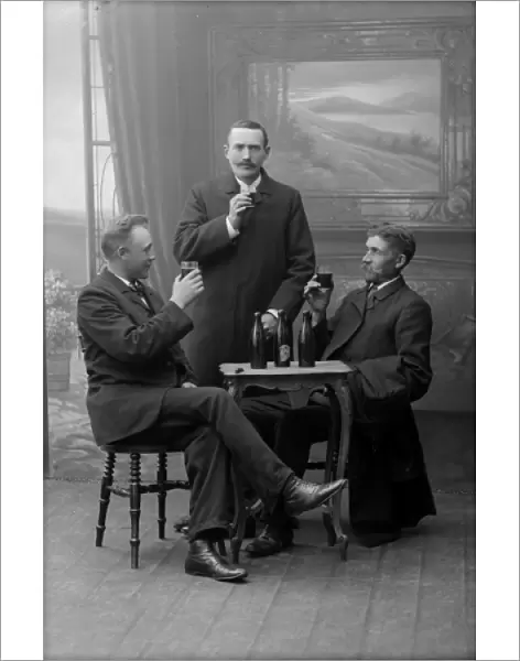 Three men drinking