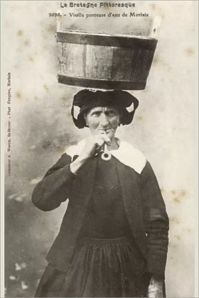 Old French Water Carrier smoking a pipe