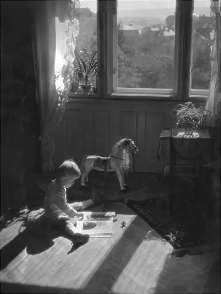 Boy Reading in Nursery