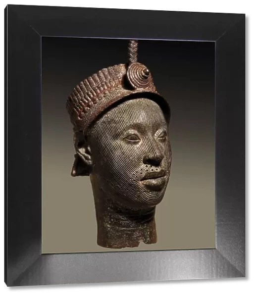 Bronze head with beaded crown and plume. 12th-14th