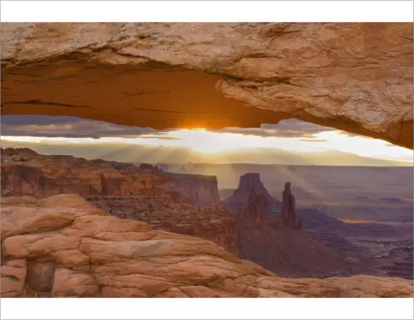 Mesa Arch - View through Mesa Arch into the maze of canyons and rock formations - Islands in the Sky, Canyonlands National Park, Utah, USA