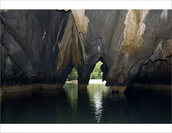 Limestone formations on the exit from the cave - that features a limestone karst mountain landscape with an 8. 2 km. navigable underground river, supposedly the longest navigable underground river in the world
