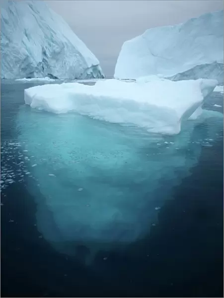 Iceberg floating in the sea. Photographed off the western coast of Greenland