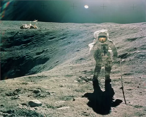 Astronaut Duke next to Plum Crater, Apollo 16
