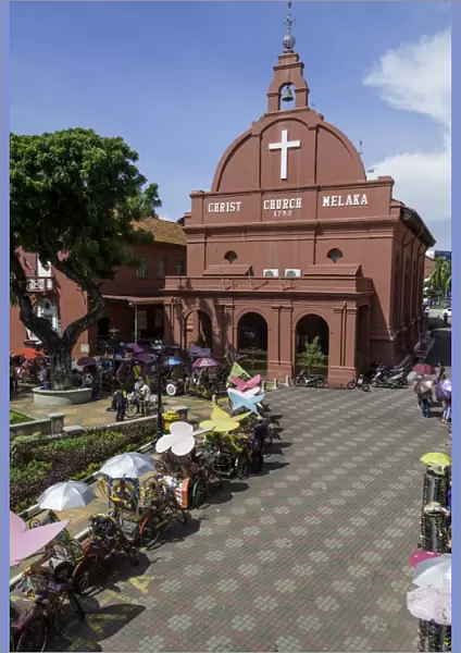 Rickshaws outside Christ Church in the town square, Melaka (Malacca), UNESCO World Heritage Site