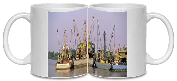 Fishing boats on the Sarawak River waterfront in Kuching