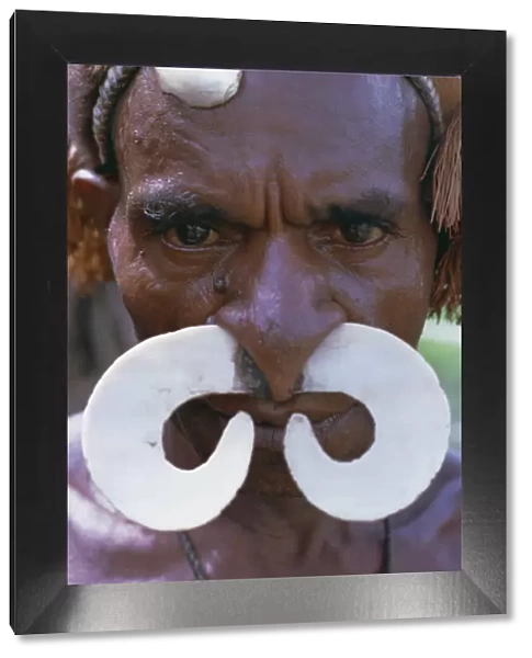Portrait of an Asmat man with nose ornament