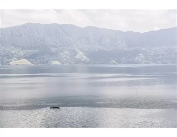Fishing boat on Lake Toba (Danau Toba), the largest volcanic lake in the world, North Sumatra