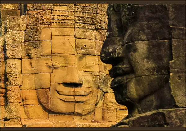 Two of 216 smiling sandstone faces at 12th century Bayon, King Jayavarman VIIs last