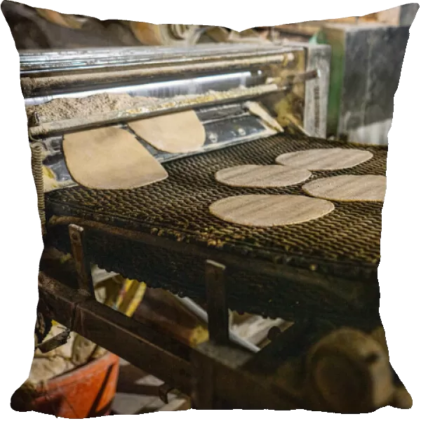 Fresh Roti being made on a conveyor belt at the Golden Temple, Amritsar, Punjab, India, Asia