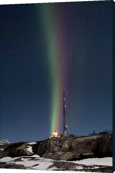 Vertical multi coloured stripes of the Aurora Borealis (Northern Lights) over Tungeneset Lighthouse, Tungeneset, Senja, Troms og Finnmark county, Norway, Scandinavia, Europe