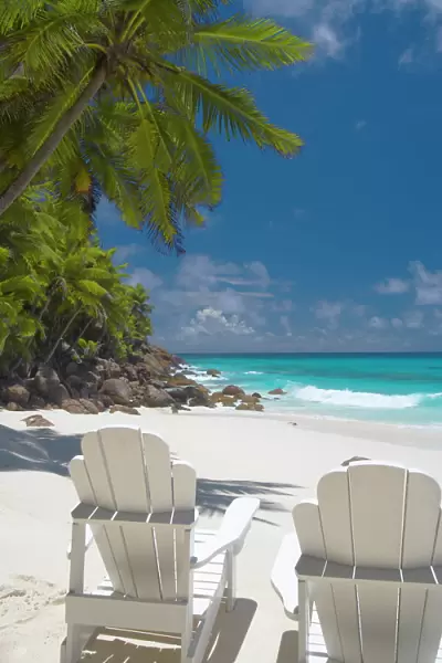 Two Adirondack chairs on tropical beach, Seychelles, Indian Ocean, Africa