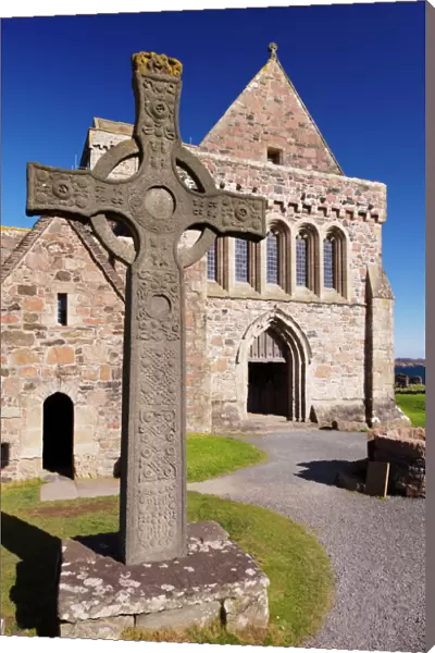 Replica of St. Johns cross stands proudly in front of Iona Abbey, Isle of Iona