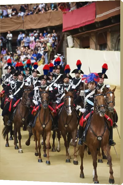 Horses and guards parading at El Palio horse race festival, Piazza del Campo