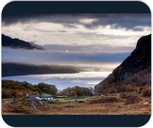 Early morning mist hanging over Loch Maree with Tollie Farm in foreground