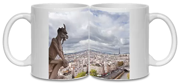 A gargoyle on Notre Dame de Paris cathedral keeping a watchful eye over the city below, Paris, France, Europe