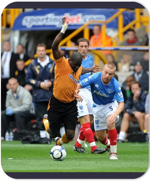 Clash of the Titans: Elokobi vs. O'Hara in Wolverhampton Wanderers vs. Portsmouth Barclays Premier League Showdown