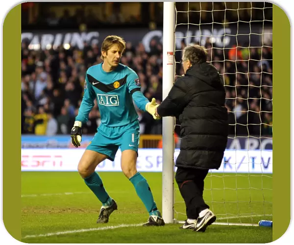 An Unusual Delivery: Edwin van der Sar Receives an Energy Biscuit During Wolverhampton Wanderers vs Manchester United (Barclays Premier League)