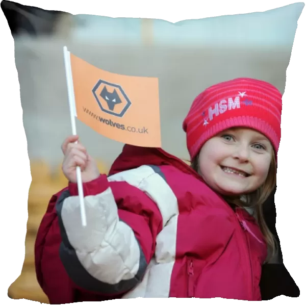 Jubilant Wolves Fans Celebrate Premier League Victory over Blackpool with Flag Wave at Molineux Stadium