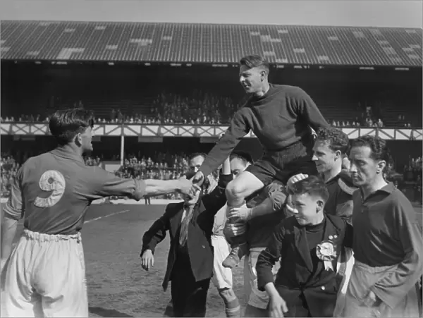Everton goalkeeper Ted Sagar is chaired off by his teammates after his last game for the club