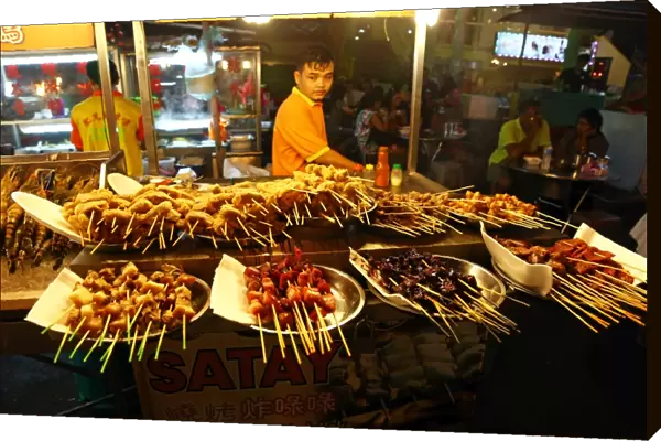 Satay stall with street food in Jalan Alor in Bukit Bintang in Kuala Lumpur, Malaysia