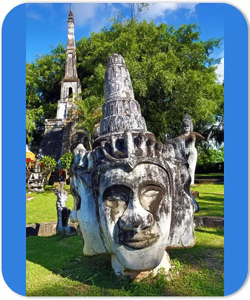 Statues of Buddha heads and faces at the Buddha Park, Vientiane, Laos