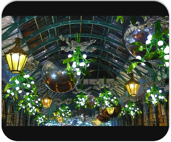 Covent Garden Christmas decorations and lights shaped like mistletoe in London