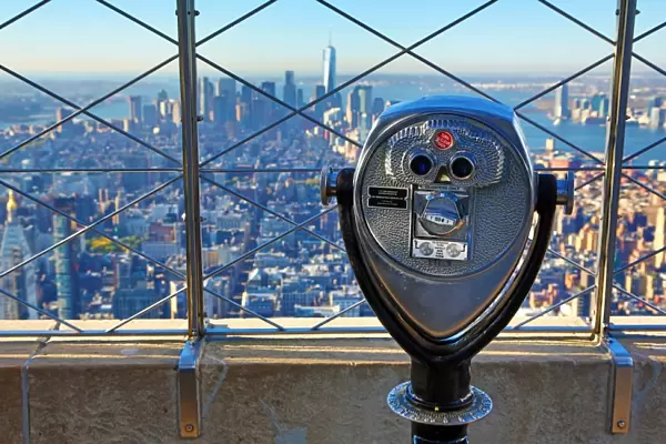 New York Manhattan city skyline and tower viewer telescope binoculars on the Empire State Building observatory viewing deck, New York, America