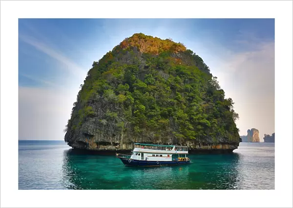 Tour boat and island on Ko Phi Phi Le island, Andaman Sea, Thailand