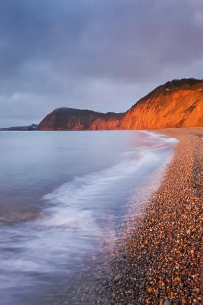 Burning red cliffs at Sidmouth on the Jurassic Coast, Devon, England. Winter