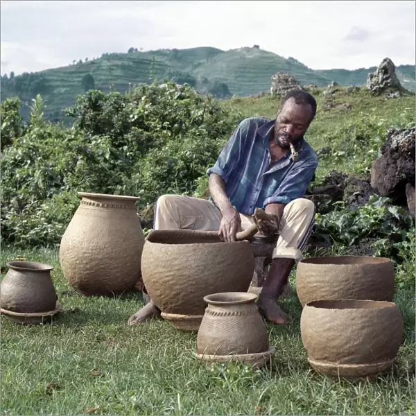 A potter fashions cooking pots by the coil method