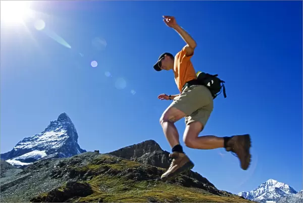 A Matterhorn (4477m) hiker running the trail