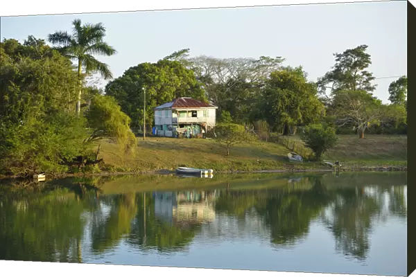 House on the banks of the Belize River, Burrel Boom Village, Belize City, Central America