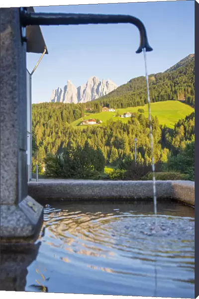 Odle peaks reflected in a fountain, Dolomites, South Tyrol, Trentino Alto Adige, Italy