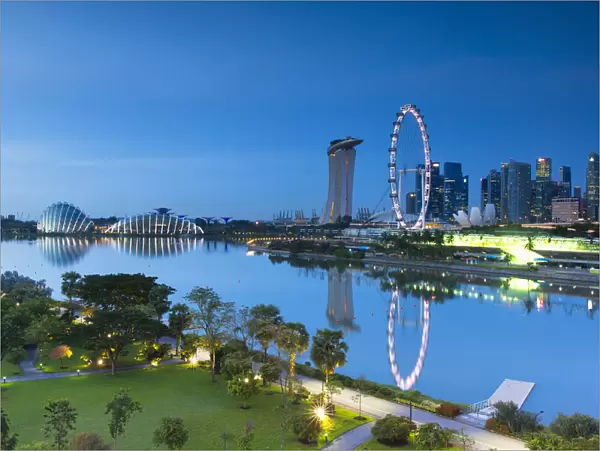 View of Singapore Flyer, Marina Bay Sands Hotel and Gardens by the Bay at dawn, Singapore