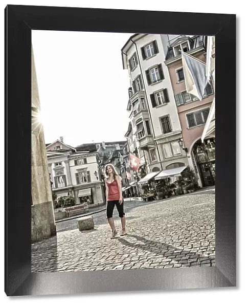 Girl walking on Munzplatz, Zurich, Switzerland, Europe