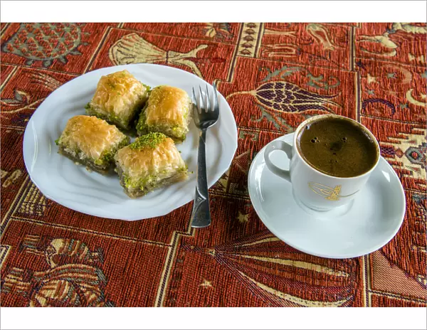 Plate with traditional baklava Turkish sweet and cup of Turkish coffee