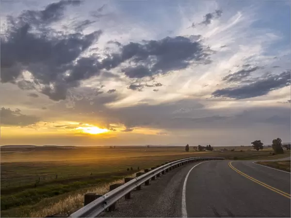 USA, Montana, Bozeman, rural road at sunset