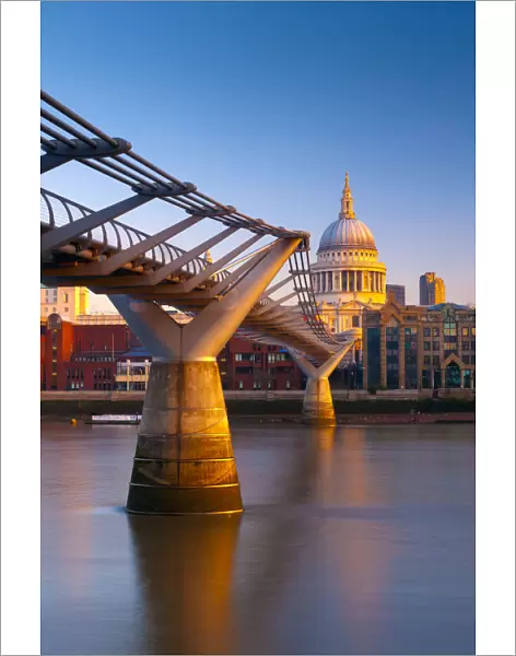 UK, London, St. Pauls Cathedral and Millennium Bridge over River Thames