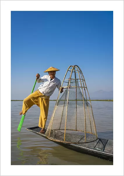 Intha fisherman with a traditional conical fishing, Lake Inle, Nyaungshwe Township
