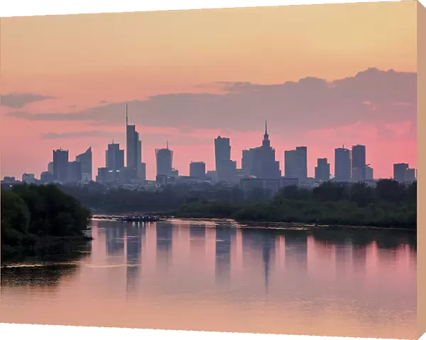 View over River Vistula towards City Centre Skyline at sunset, Warsaw, Masovian Voivodeship, Poland