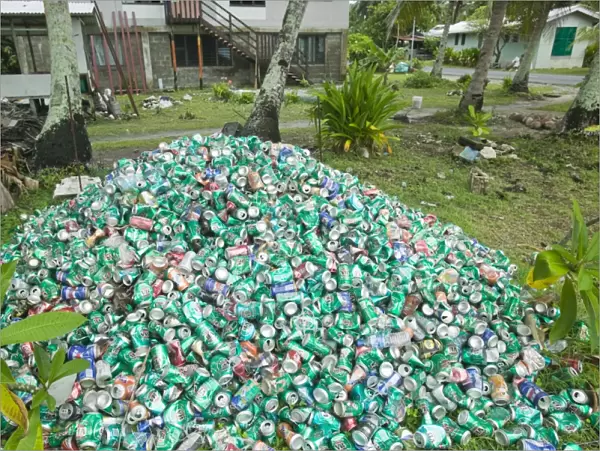 Beer cans piled up in a garden on Funafuti atol Tuvalu