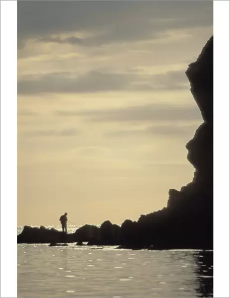 Silhouette of fisherman, Porthlysgi Bay, Pembrokeshire, Wales, UK, Europe (rr)